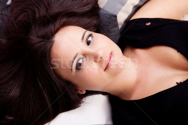 beautiful and smiling middle-age woman lying Stock photo © alexandrenunes