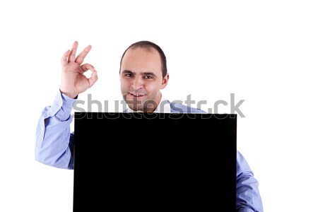 Young businessman holding a blackboard displaying the sign of success Stock photo © alexandrenunes