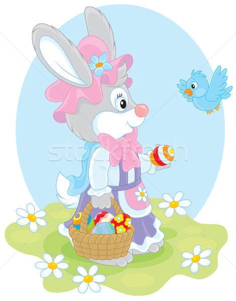 Easter Bunny with a basket of eggs Stock photo © AlexBannykh