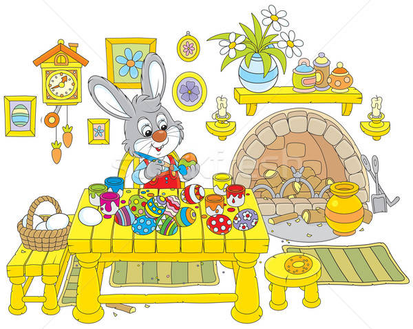Bunny paints Easter eggs Stock photo © AlexBannykh