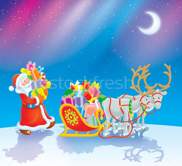 Santa loads Christmas gifts into his sleigh Stock photo © AlexBannykh