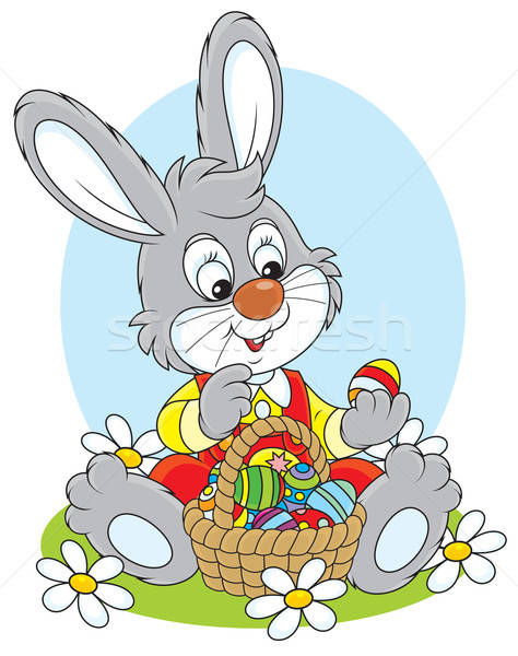 Easter Bunny with a basket of eggs Stock photo © AlexBannykh