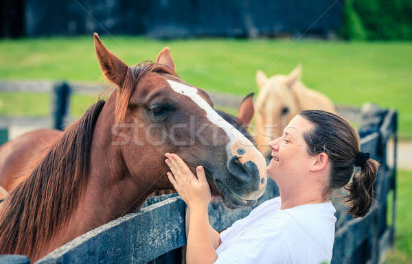 Stock photo: Woman with a horse