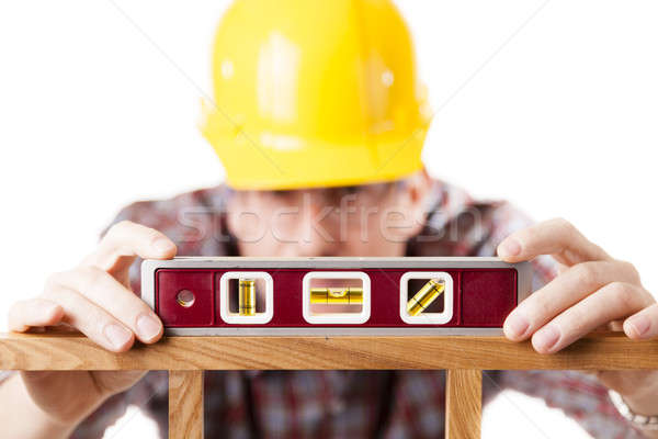 Worker using level Stock photo © alexeys