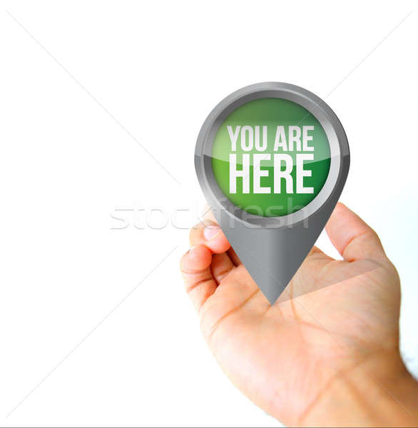 Hand holding a you are here pin pointer sign  Stock photo © alexmillos