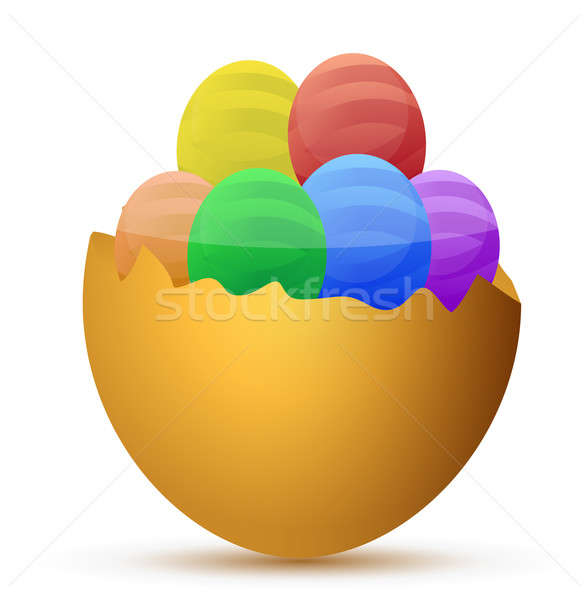Broken egg filled with little chocolate eggs Stock photo © alexmillos