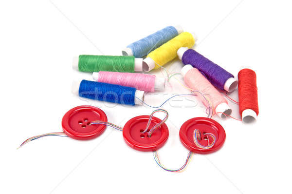 Red buttons and thread spools  on white background Stock photo © alinamd