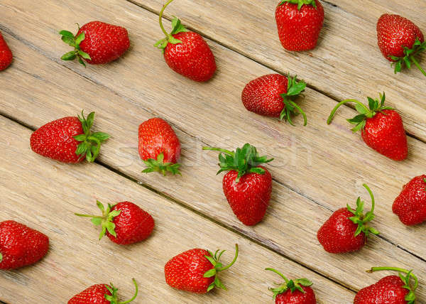 strawberries on a wooden surface background Stock photo © alinamd