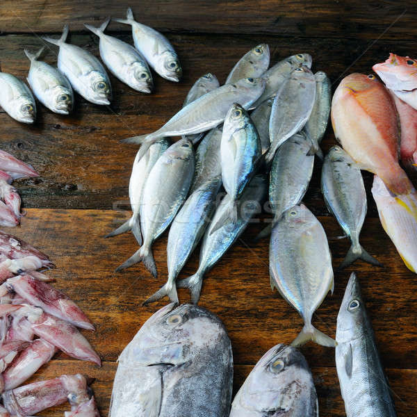 fresh fish and other seafood on a wooden table Stock photo © alinamd
