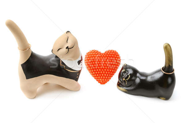 Clay figurines of cats with golden ornaments. Isolated on white  Stock photo © alinamd