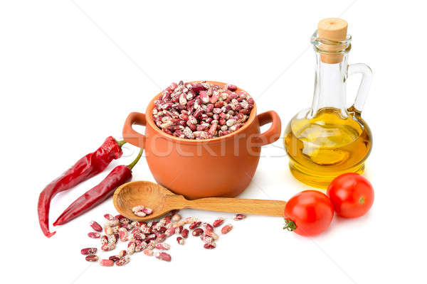 beans in a ceramic pot, cooking oil and vegetables isolated on w Stock photo © alinamd