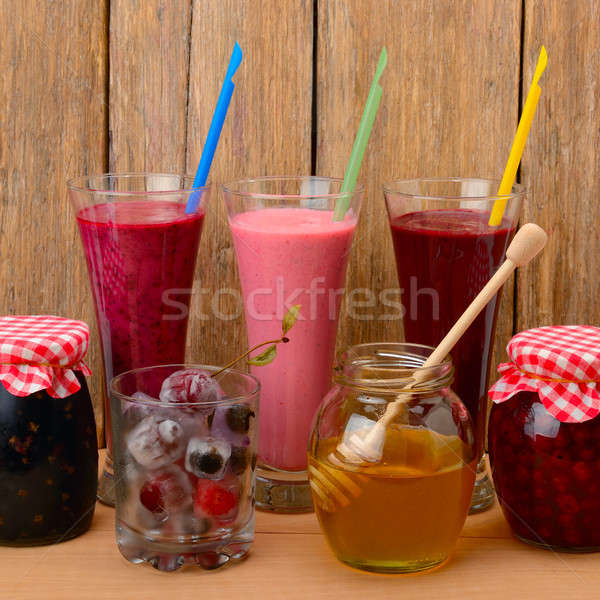 Set of berry smoothies, jams and frozen berries Stock photo © alinamd