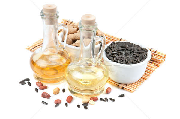 Sunflower seeds, peanuts and bottle of oil Stock photo © alinamd