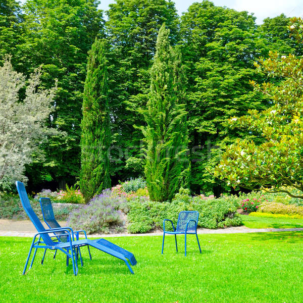 Stock photo: beautiful summer park with lawn and recliner