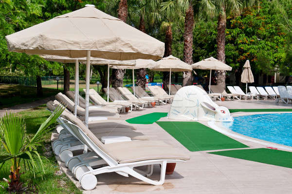 outdoor swimming pool and beautiful palm trees Stock photo © alinamd