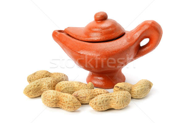 Peanuts and clay amphora isolated on white background Stock photo © alinamd