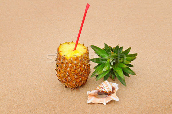 composition of juicy pineapple and sea shells on sand background Stock photo © alinamd