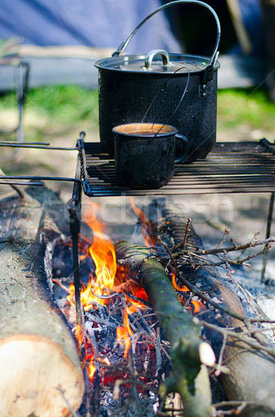 Tourist boiler with food and a mug with water on a fire Stock photo © AlisLuch