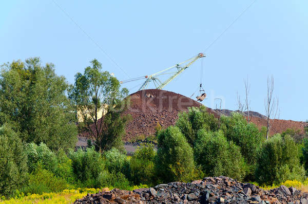 The excavator on formation of quartzite dump Stock photo © AlisLuch