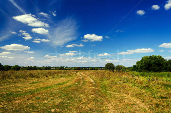 Landschap onverharde weg platteland najaar wolken achtergrond Stockfoto © AlisLuch