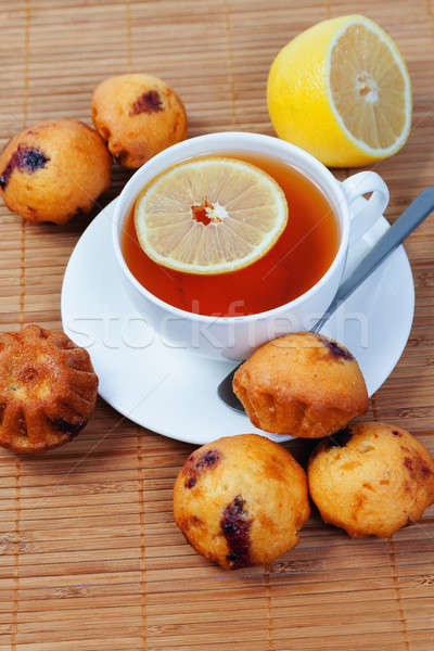 Stock photo: Cup of tea, cakes and lemon