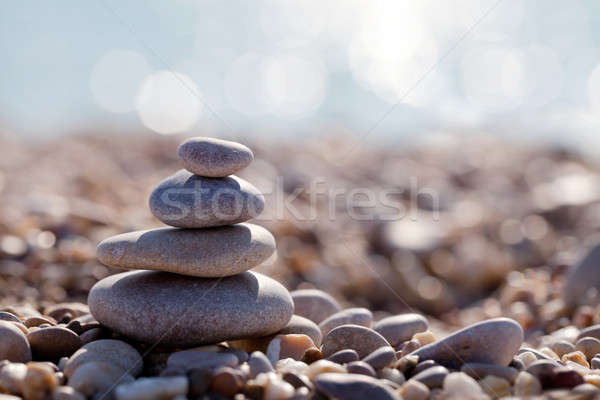 Piramis kavicsok tengerpart tájkép tenger kék Stock fotó © All32