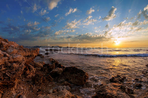 Stock fotó: Tengeri · kilátás · tengerpart · kövek · víz · naplemente · tájkép