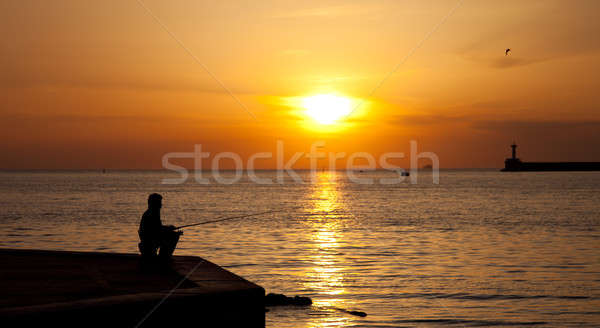 Silhouettes of Fishermen at sunset Stock photo © All32