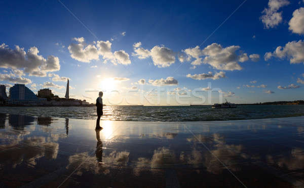 Silhouette of a boy on the seafront Stock photo © All32
