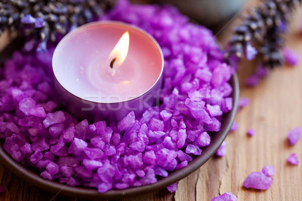 Candle in a saucer with salt baths and sprigs of lavender Stock photo © All32