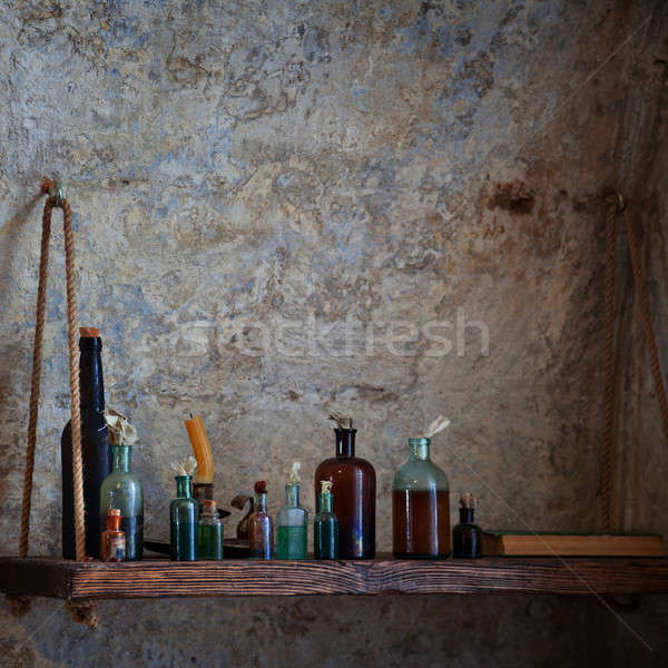 Old bottles of various liquids on the shelf Stock photo © All32