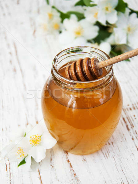 Honey with jasmine flowers Stock photo © almaje