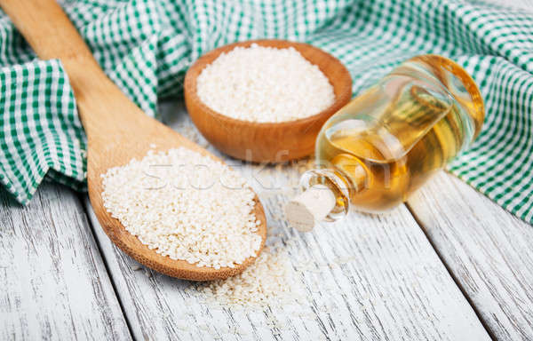 Sesame seeds and bottle with oil Stock photo © almaje