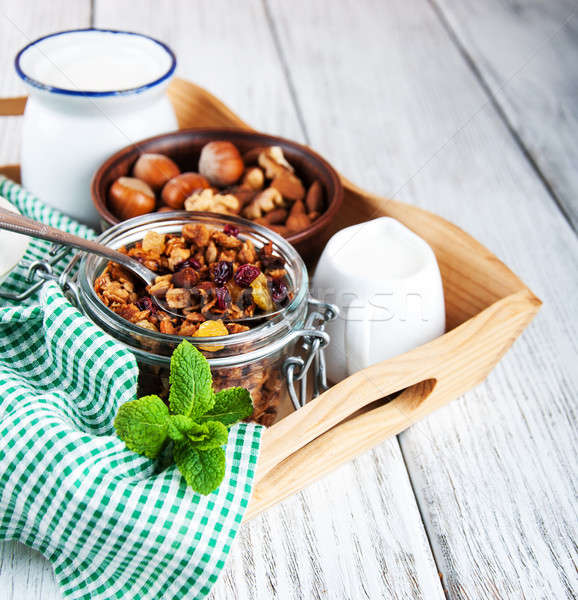 домашний гранола орехи молоко деревянный стол фрукты Сток-фото © almaje