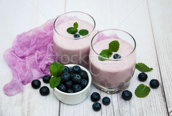 Szemüveg áfonya joghurt asztal friss bogyók Stock fotó © almaje