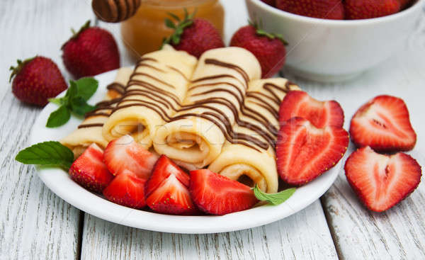 crepes with strawberries and chocolate sauce Stock photo © almaje