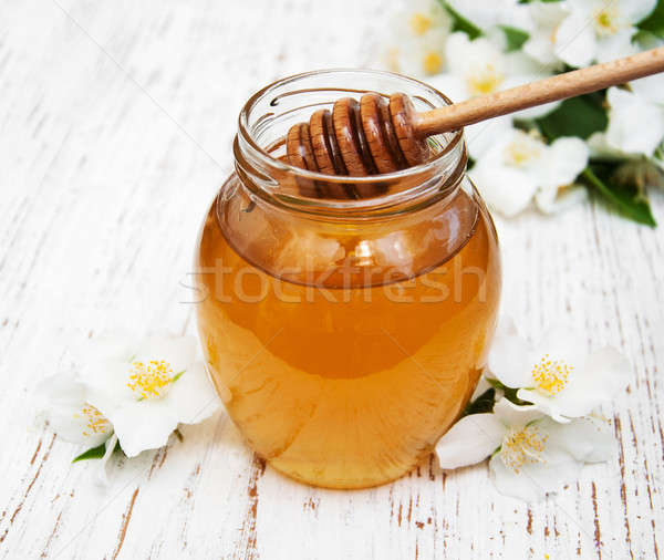 Honey with jasmine flowers Stock photo © almaje