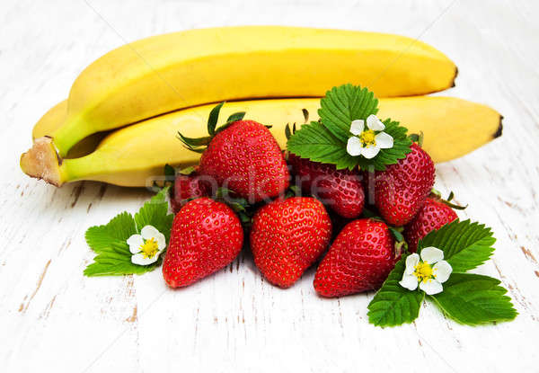 Bananas and strawberries Stock photo © almaje