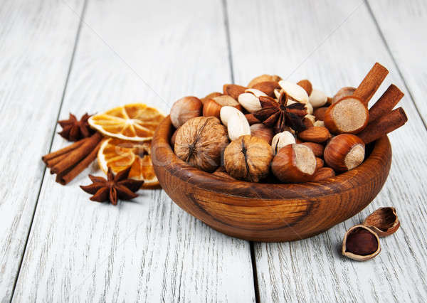 Différent noix vieux table en bois fond orange [[stock_photo]] © almaje