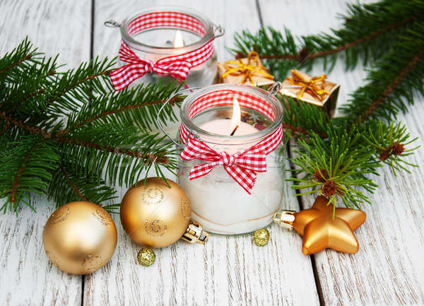  christmas decorations candles in glass jars with fir Stock photo © almaje