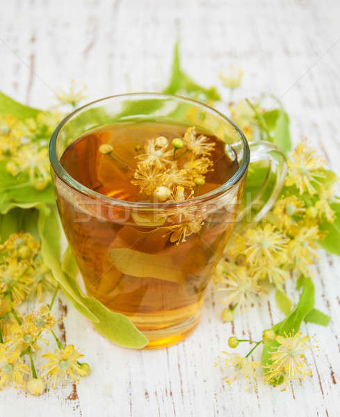 Cup of herbal tea with linden flowers Stock photo © almaje