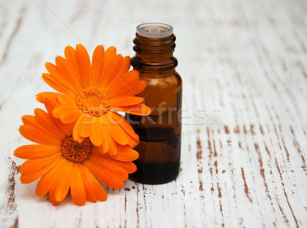 Stock photo: calendula flowers and massage oil