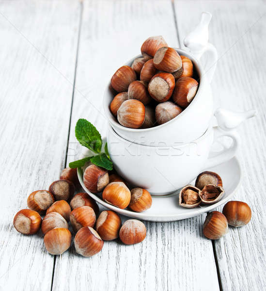 Cups with hazelnuts Stock photo © almaje