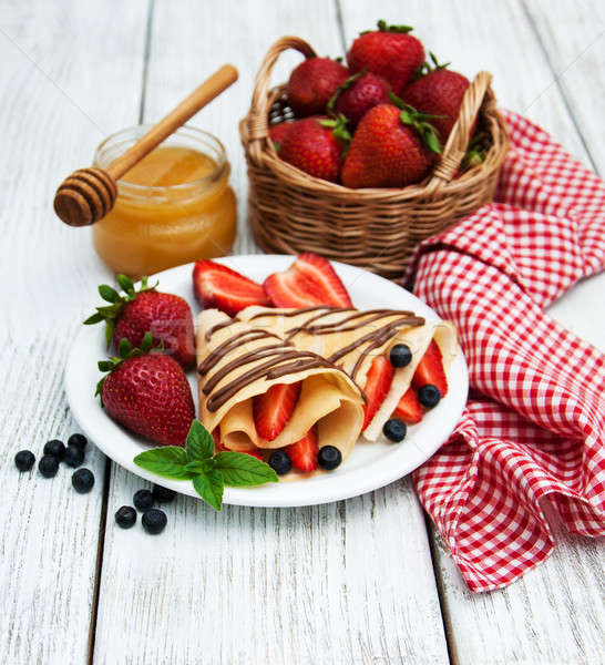 crepes with strawberries and chocolate sauce Stock photo © almaje