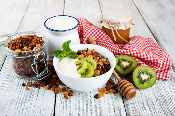Granola cereal nozes iogurte velho mesa de madeira Foto stock © almaje
