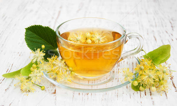 Stock photo: Cup of herbal tea with linden flowers