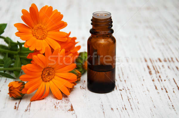 Virágok masszázsolaj fából készült háttér gyógyszer ipar Stock fotó © almaje