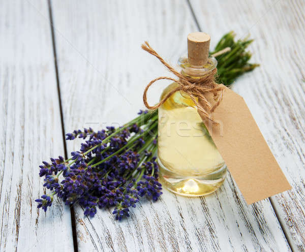 Bottle with oil, empty tag and lavender flowers Stock photo © almaje