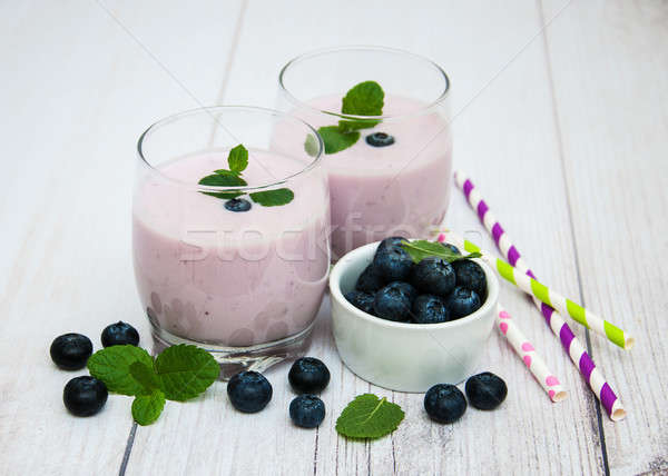 Glasses with blueberry yogurt on a table Stock photo © almaje
