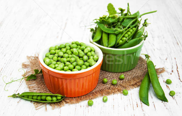 Bowls with fresh peas Stock photo © almaje